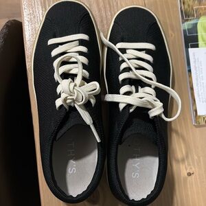 Rothy’s 
“The lace up” sneaker 
Black size 7